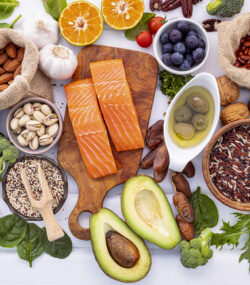 Ingredients for the healthy foods selection on white background. Balanced healthy ingredients of unsaturated fats and fiber for the heart and blood vessels.