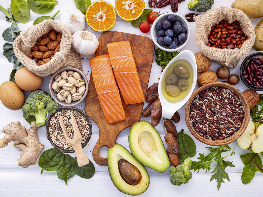 Ingredients for the healthy foods selection on white background. Balanced healthy ingredients of unsaturated fats and fiber for the heart and blood vessels.